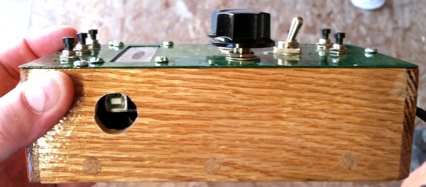 Side view of the VMU control box showing the drilled USB access hole